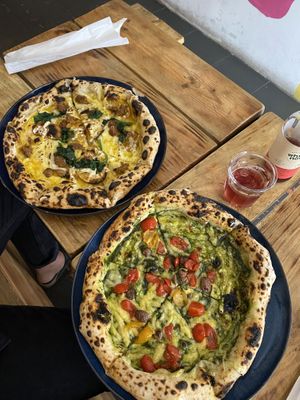 Pesto Pizza & Pizza with beyond meat sausage at Plant Base in Lisbon