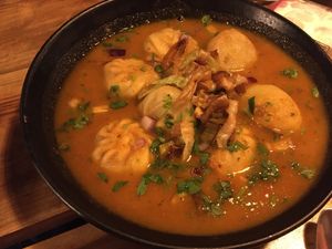 Momos (dumplings) in curry spicy sauce at Plant Base in Lisbon