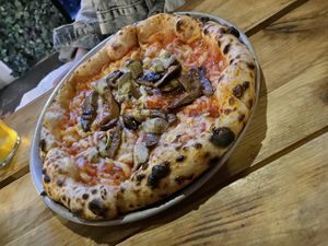 Flat and greasy pizza  at Plant Base in Lisbon