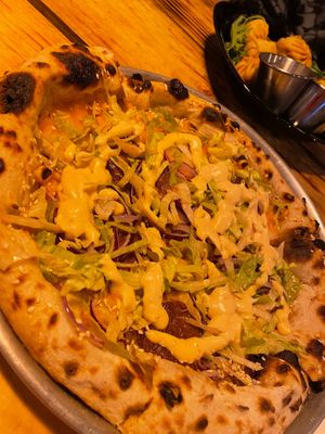 Pizza with cheddar cheese and beyond meat. at Plant Base in Lisbon