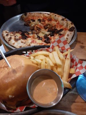 Classic burger and Pizza at Plant Base in Lisbon