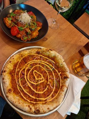 Chorizo pizza & spicy Momos at Plant Base in Lisbon
