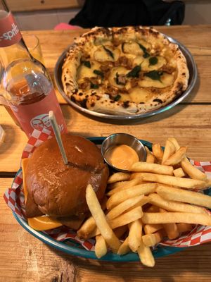 Classic burger and patata and salsiccia pizza  at Plant Base in Lisbon