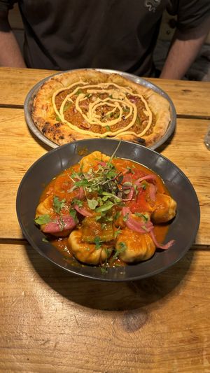  Chorizo pizza and spicy momos   at Plant Base in Lisbon