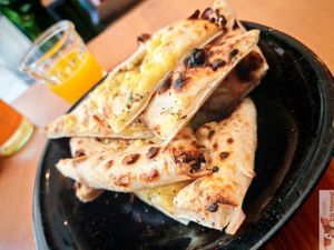 Pizza bread with vegan cheese at Plant Base in Lisbon