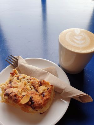 Raspberry bakewell + oat cappuccino at Yallah Coffee Kiosk in St Ives