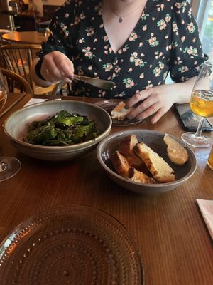 Padrón peppers and bread. I had a glass of some amazing orange wine.  at Metro in Malmo