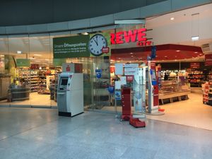 Front entrance, near regional train station inside airport at FRA - REWE City - T1 in Frankfurt
