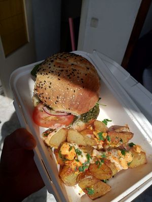 crazy burger + bravas to take away  at Cat Bar in Barcelona