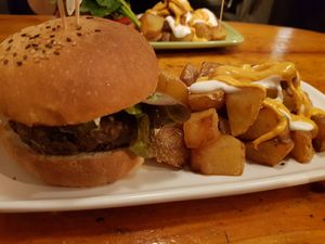Black burger and bravas at Cat Bar in Barcelona