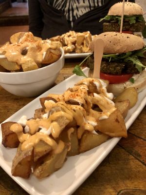 Champion Burger with Extra Bravas!  at Cat Bar in Barcelona