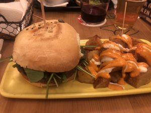Burger and bravas  at Cat Bar in Barcelona