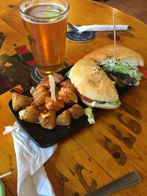 veg burger and patatas brava at Cat Bar in Barcelona