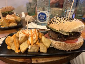 Black cat burger with bravas    at Cat Bar in Barcelona