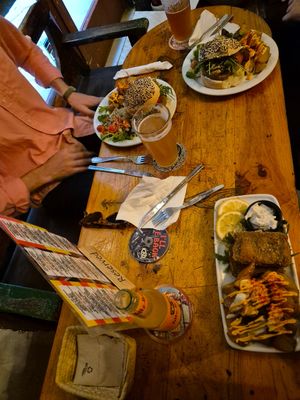 One fish and chips and two cat burgers at Cat Bar in Barcelona