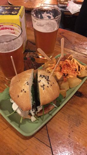 Green burger with patatas bravas at Cat Bar in Barcelona