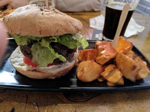Black Cat burger and patatas bravas at Cat Bar in Barcelona
