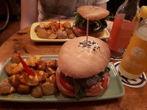 Green burger with patatas at Cat Bar in Barcelona
