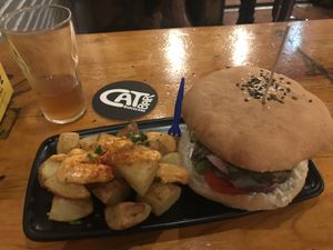 Burger and roast potatoes at Cat Bar in Barcelona