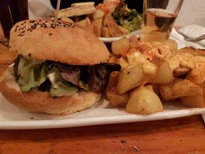 Black cat burger and bravas at Cat Bar in Barcelona