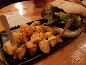 Black cat and bravas at Cat Bar in Barcelona