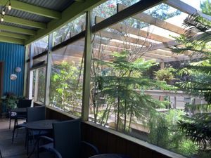 Screened in outdoor seating   at Lotus Cafe in Panama City Beach