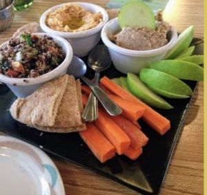 House-made vegan cheeses
served with w/sliced apples & veggies    at Lotus Cafe in Panama City Beach