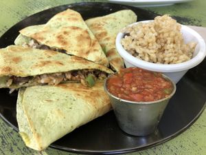 Vegan tempeh quesadilla with rice and beans as side at Lotus Cafe in Panama City Beach