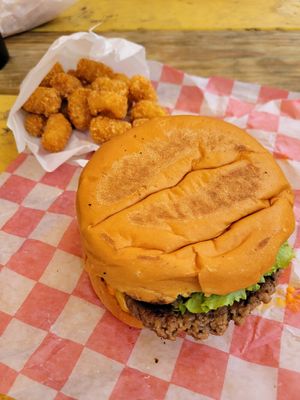 OG cheeseburger with Tater tots at Nom Burgers in Austin