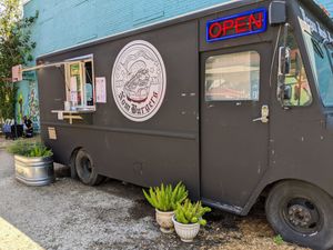 Parked where Vegan Nom used to sit, Vegan Nom is now across the yard at Nom Burgers in Austin