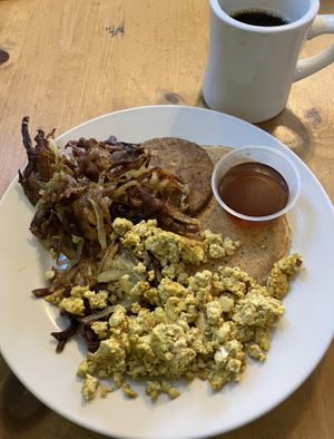 Veganized Grand Slam. One fluffy pancake, hash browns, tofu “eggs”, vegan sausage. at Seward Cafe in Minneapolis