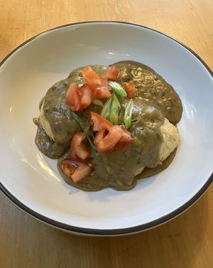 Vegan Biscuits & Gravy. Homemade vegan biscuits topped with mushroom gravy, tomatoes & scallions. at Seward Cafe in Minneapolis