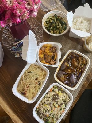 eggplant, soy beef fried rice, wok fried potatoes, orange chicken, and cucumber salad at Veggie House  in Chicago