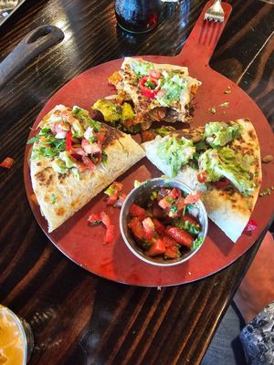 Habinero Enchiladas with guacamole at Centro Neighborhood Kitchen in Burien