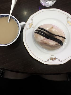 Peanut butter and chocolate glazed doughnut and coffee at Round & Square in Helsinki