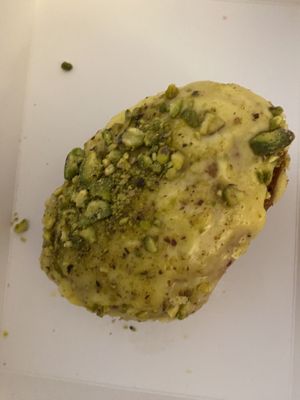 Pistachio and mango doughnut 🍩   at Round & Square in Helsinki