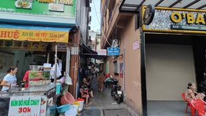 enter through this small lane at Tue Tin Chay Quan in Ho Chi Minh City