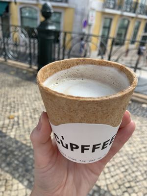 Yummy soy latte with cracker type cup (pigeons love it)  at Vegan Nata - Chiado in Lisbon