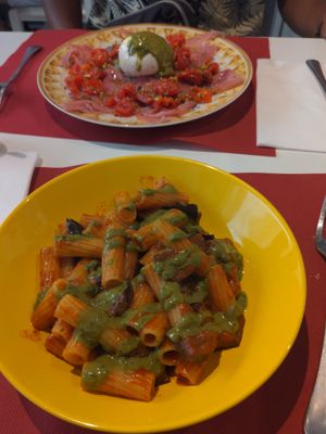 Pasta all norma (without cheese), smoked tono e burrata pomodoro in the background at Bacarretto in Venice