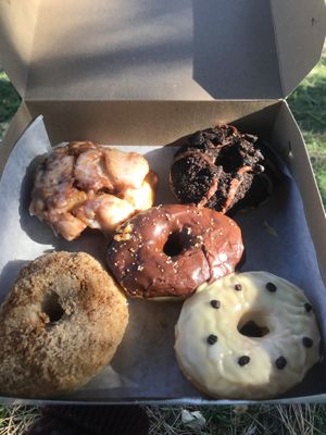 Apple (top left), Oreo (top right), Hazelnut/chocolate (middle), Cinnamon (bottom left), Passionfruit (bottom right) at La Beignerie in Montreal