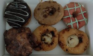 Boston cream, maple bacon, strawberry lime, apple fritter, crème brûlée at La Beignerie in Montreal