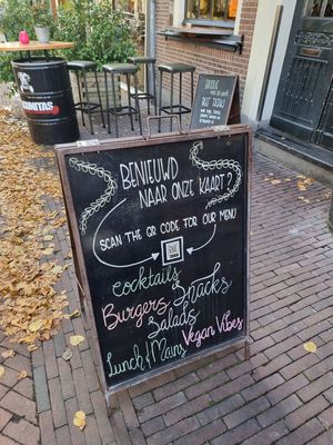 street sign mentioning vegan vibes at Wijnhaven in Delft