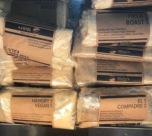 A few of the Moll's vegetarian and vegan burrito options! at Cycle & Coffee Inc in Seattle