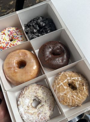 Birthday cake, oreo, vanilla, boston cream, orange poppy, coffee cake  at Beacon Doughnuts in Chicago