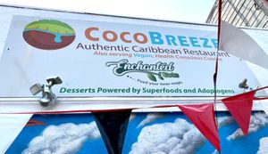 Note the outdoor sign highlighting healthy vegan options at Coco Breeze in Oakland