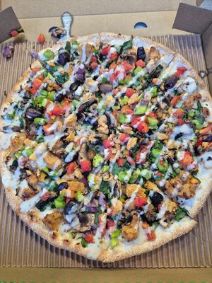 Vegans paradise pizza 22.95: quite small, base was thin and cardboardy, toppings were great and diced which i love, loved the crumbled chikn, drizzled with thin tahini dressing at OOSHMAN in Randwick