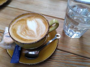 Cappuccino with oatmilk (cookie not vegan) at Zaytouna Cafe in Aachen