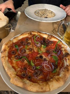 Greek Pizza without cheese (very delicious) at Fanalino Restaurant Bar in Paxos