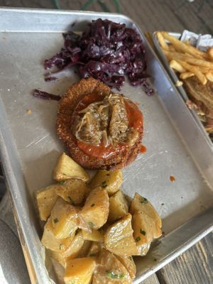 Schnitzel with potato salad and red cabbage side  at Gemüt Biergarten in Columbus