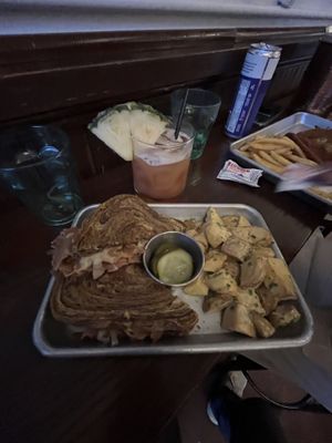 vegan Reuben and rum cocktail w the potato salad 🤍  at Gemüt Biergarten in Columbus